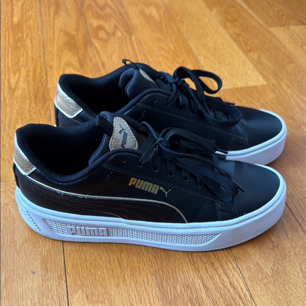 Puma Carina Black Sneakers with Gold Accents
